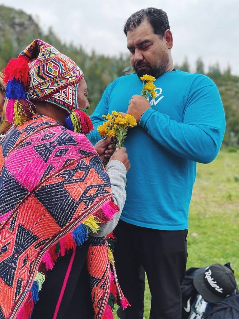 shaman cleansing man with flower