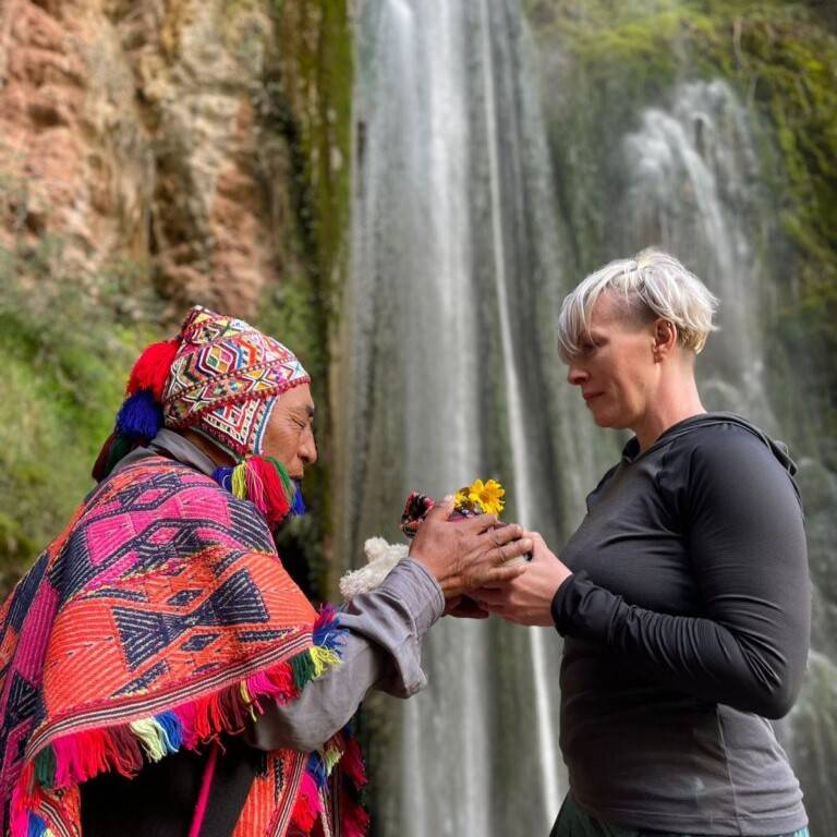 Woman in front of waterfall