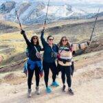 three girls with hiking poles (sacred treks)