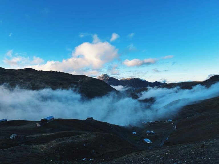 Clouds between the moutnains of a small village